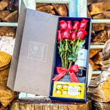 PACK FIOBOX 12 ROSAS ROJAS + BOTELLA DE VINO + CHOCOLATE